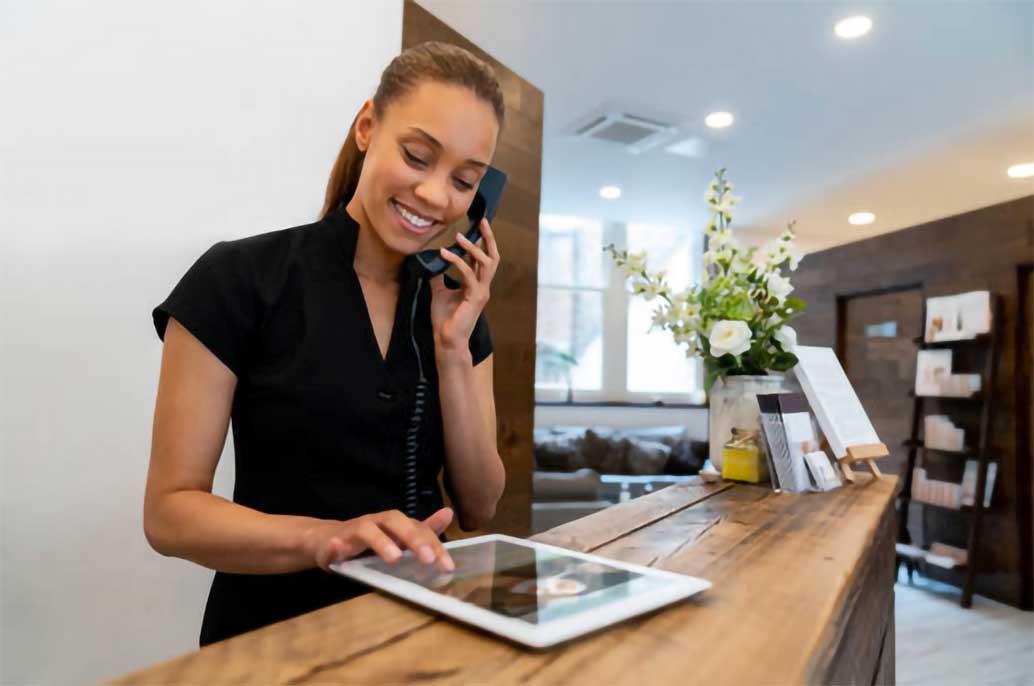 receptionist using tablet