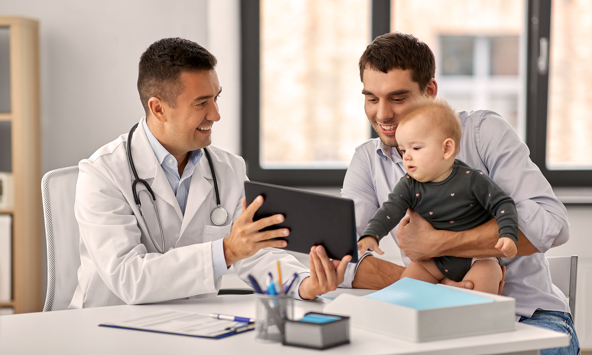 doctor showing results to patient on ipad