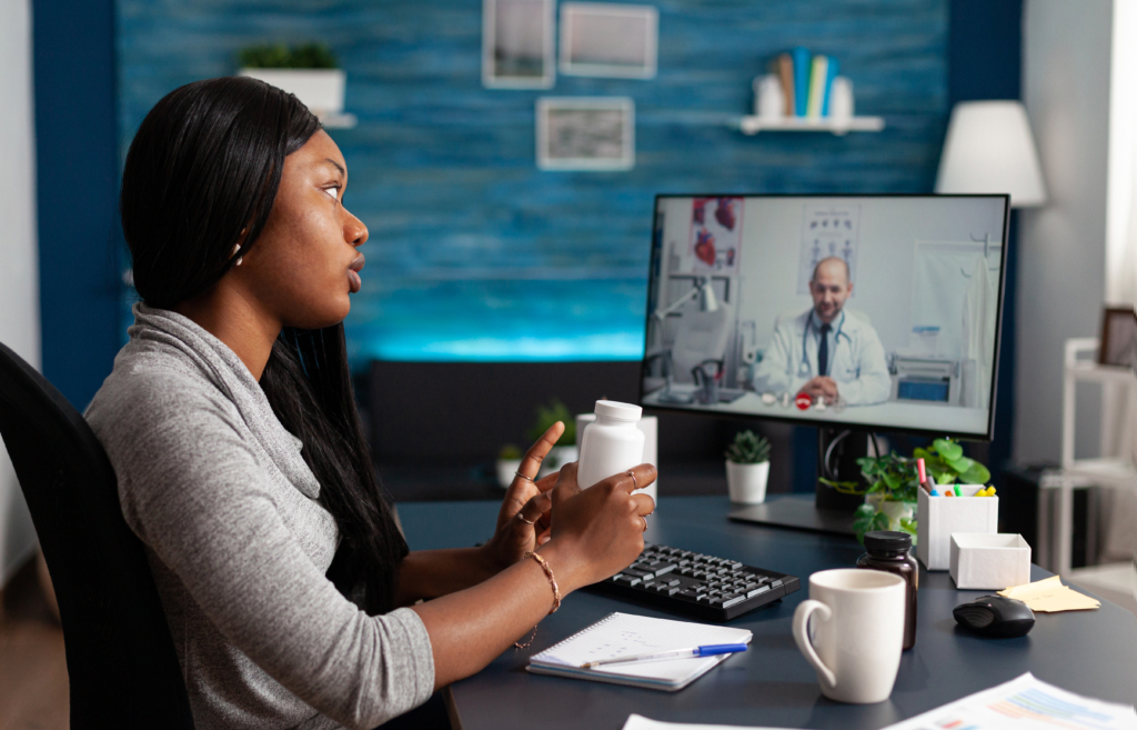 patient talking to doctor on computer